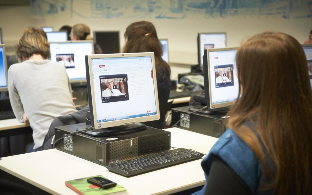Students in a computer lab using the VHA