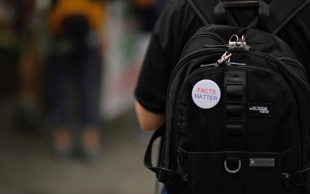 backpack with button: Facts Matter